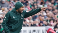 Bremen's German head coach Daniel Thioune reacts from the sidelines during the German first division Bundesliga football match in Bremen, northern Germany February 14, 2026. (Photo by Focke Strangmann / AFP) 