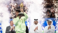 Olympic Council of Asia and Qatar Olympic Committee President H E Sheikh Joaan bin Hamad Al Thani presented the Golden Falcon Trophy to Carlos Alcaraz after the Spaniard won the Qatar ExxonMobil Open, defeating Arthur Fils of France in the final at the Khalifa International Tennis and Squash Complex yesterday. Qatar Tennis Federation President Nasser Al Khelaifi is also present.