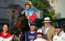 Ka Ying Rising with jockey Zac Purton and trainer David Hayes (2nd R) pose with others after victory in the Queen's Silver Jubilee Cup horse race at Sha Tin Racecourse in Hong Kong on February 22, 2026. (Photo by Peter Parks / AFP)