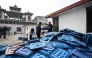 (Files) Election officials inspect ballot boxes before they are dispatched from the Election Commission office in Kathmandu on February 9, 2026 ahead of Nepal's general elections. (Photo by Prakash MATHEMA / AFP)