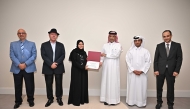 QICCA Vice Chairman Sheikh Dr. Thani bin Ali Al Thani presenting a cerificate to one of the trainees in the presence of other officials.