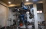 This photograph shows a worker weilding scrap metal into Optimus Prime, a film character from Transformers, at a studio on the outskirts of Islamabad. Sparks fly and metal groans in a cavernous workshop on the outskirts of Islamabad, where Pakistani artist Ehtisham Jadoon fuses discarded car parts into colossal pieces inspired by 