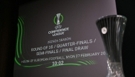 This photograph shows the UEFA Conference League Cup displayed next to a screen announcing the 2025-2026 UEFA Conference League round of 16, quarter-final and semi-final draw at the House of European Football in Nyon, western Switzerland on February 27, 2026. (Photo by Harold CUNNINGHAM / AFP)
