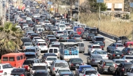 Motorists block the highway as they flee their villages in southern Lebanon along the coastal road through the city of Sidon on March 2, 2026.(Photo by Mahmoud Zayyat / AFP)