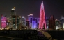 High-rise buildings are pictured at night along the Corniche in Doha on March 1, 2026. (Photo by Karim Jaafar / AFP)
