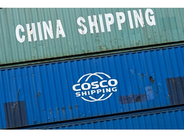 (Files) Containers of China Shipping and Cosco shipping companies are stacked at a transshipment station in Frankfurt am Main, western Germany, on April 15, 2025.  (Photo by Kirill Kudryavtsev / AFP)