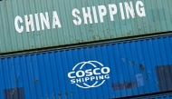 (Files) Containers of China Shipping and Cosco shipping companies are stacked at a transshipment station in Frankfurt am Main, western Germany, on April 15, 2025.  (Photo by Kirill Kudryavtsev / AFP)