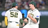 Australia's closing pitcher Jon Kennedy (R) celebrates victory over Taiwan at the World Baseball Classic (WBC) Pool C first round game between Australia and Taiwan at the Tokyo Dome on March 5, 2026. (Photo by Kazuhiro Nogi/ AFP) 
