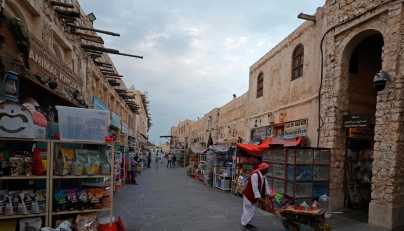 Visitors walk through a bird market at Souq Waqif in Doha on March 4, 2026. Photo by Karim JAAFAR / AFP