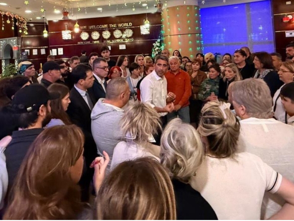 Ambassador of Georgia H E Varlam Avaliani with Georgian citizens who were repatriated. 