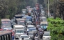People wait in a queue (R) to refuel their vehicles near a fuel station in Dhaka on March 8, 2026. (Photo by Munir Uz Zaman / AFP)
