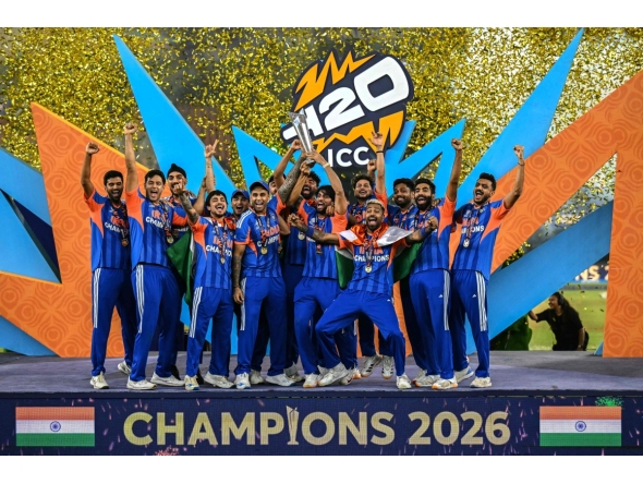 Indian players celebrate with the trophy after winning the 2026 ICC Men's T20 cricket World Cup final match against New Zealand at the Narendra Modi Stadium in Ahmedabad on March 8, 2026. (Photo by Punit PARANJPE / AFP)