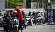 Motorists queue at a gas station amid rising petrol prices in Quezon City, Metro Manila on March 9, 2026. (Photo by Jam Sta Rosa / AFP)