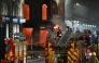 Floors collapse inside the building as fire fighters work at the site of a large fire in Glasgow City centre on March 8, 2026. (Photo by Andy Buchanan / AFP)