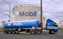 A fuel tanker passes the Mobil fuel distribution centre in the Melbourne suburb of Yarraville on March 12, 2026 as the demands and prices of petrol and diesel soar due to the Middle East conflict.  (Photo by William West / AFP)