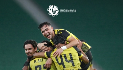 Qatar SC's Mus’ab Al Battat celebrates with teammates. 