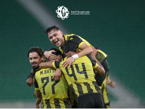 Qatar SC's Mus’ab Al Battat celebrates with teammates. 