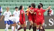 China players (R) celebrate a goal by teammate Shao Ziqin during the AFC Women's Asian Cup Australia 2026 football match between China and Taiwan in Perth. (Photo by Antony Dickson/ AFP) 