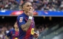 Barcelona's Brazilian forward #11 Raphinha celebrates scoring his team's fourth goal and his hat-tick, during the Spanish League football match between FC Barcelona and Sevilla FC at the Camp Nou Stadium in Barcelona, on March 15, 2026. (Photo by Lluis GENE / AFP)
