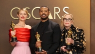 (L-R) Jessie Buckley, Michael B. Jordan, and Amy Madigan pose in the press room. Mike Coppola/Getty Images/AFP 