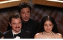 Puerto Rican actor Benicio Del Toro, US actress Chase Infiniti and US actor Leonardo DiCaprio onstage during the 98th Annual Academy Awards. (Photo by Patrick T. Fallon / AFP)