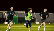 Al Sadd's Akram Afif (centre) trains with teammates.