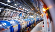 TOSome of the 1232 dipole magnets that bend the path of accelerated protons are pictured in the Large Hadron Collider (LHC) in a tunnel of the European Organisation for Nuclear Research (CERN), during maintenance works on February 6, 2020 in Echenevex, France, near Geneva. Photo by VALENTIN FLAURAUD / AFP