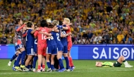 Japan's players celebrate winning the final of the AFC Women Asian Cup Australia 2026 football tournament between Australia and Japan at Stadium Australia in Sydney on March 21, 2026. (Photo by Saeed Khan / AFP)