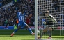 Brighton's English striker #18 Danny Welbeck scores their second goal during the English Premier League football match between Brighton and Hove Albion and Liverpool at the American Express Community Stadium in Brighton, southern England on March 21, 2026. (Photo by Glyn KIRK / AFP) 