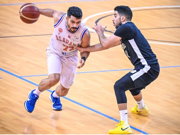 Al Arabi's Mustafa Hussain (left) excelled against Al Sadd scoring 28 points. 