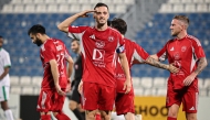 Al Arabi's Pablo Sarabia (centre) celebrates after scoring a goal.