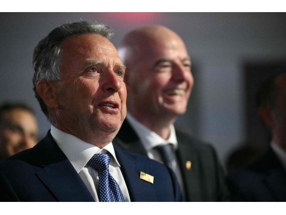 US Special Envoy to the Middle East Steve Witkoff (L) and FIFA President Gianni Infantino smile as US President Donald Trump speaks during the Future Investment Initiative (FII) Summit in Miami Beach, Florida, on March 27, 2026. (Photo by Mandel NGAN / AFP)