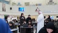 Minister of Education and Higher Education H E Lolwah bint Rashid bin Mohammed Al Khater inspects as students sit an admission test at Qatar Science and Technology School for Girls.