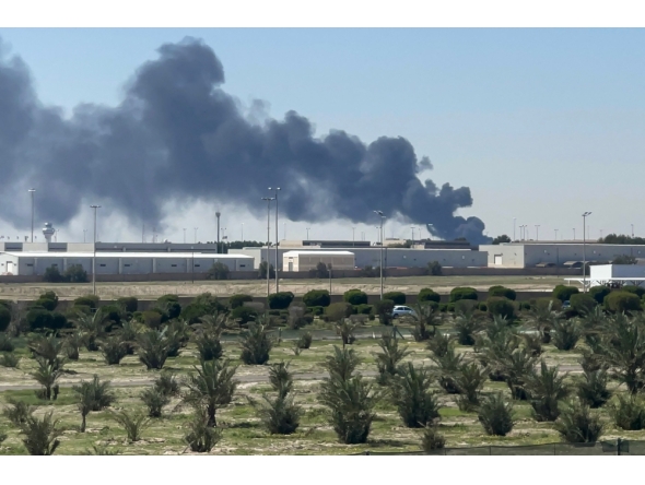Smoke rises from an area of Kuwait's international airport after a reported drone strike on April 1, 2026. (Photo by AFP) 
