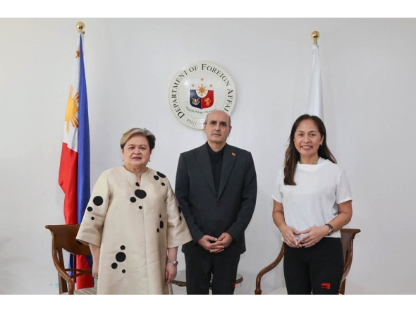 In this handout photo taken April 1, 2026 and released by the Philippine Department of Foreign Affairs shows Philippine Secretary of Foreign Affairs Thereza Lazaro (L), Iranian Ambassador to the Philippines Yousef Esmaeilzadeh (C) and Philippine Secretary of Energy Sharon Garin posing for a photo during a bilateral meeting in Manila. (Photo by Handout / Philippine Department of Foreign Affairs / AFP) 