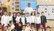 Undersecretary of the Ministry of Education and Higher Education Dr. Ibrahim bin Saleh Al-Nuaimi with pupils at a school. 
