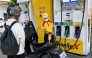 An employee pumps gasoline into the motorbike of a customer at a fuel station in Phnom Penh on April 1, 2026. (Photo by Tang Chhin Sothy / AFP)