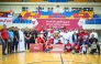 Qatar Basketball Federation President Mohammed bin Saad Al Mughaisib presents the trophy. 
