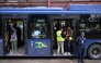 Passengers gather aboard a government bus at a bus stop in Islamabad on April 3, 2026. Photo by Farooq NAEEM / AFP