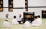 Children learn Quran recitation at a mosque.  