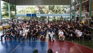 A group of men wait for the drawing of the Thai military conscription lottery at Watmatchantikaram School in Bangkok on April 7, 2026. (Photo by Chanakarn Laosarakham / AFP)