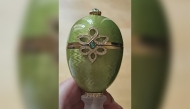 This undated handout photo released by the Metropolitan Police to AFP on April 9, 2026 shows a green and gold, emerald-encrusted Faberge egg, which was stolen from outside a pub in 2024. Photo by Handout / Metropolitan Police / AFP