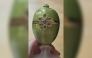 This undated handout photo released by the Metropolitan Police to AFP on April 9, 2026 shows a green and gold, emerald-encrusted Faberge egg, which was stolen from outside a pub in 2024. Photo by Handout / Metropolitan Police / AFP