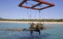 The wreckage of a Shidenkai fighter plane of the former Imperial Japanese Navy is lifted from the seabed off Akune, Kagoshima Prefecture, on Wednesday.