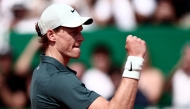 Italy's Jannik Sinner celebrates after winning against Germany's Alexander Zverev during the Monte Carlo ATP Masters Series Tournament semi-final tennis match on Court Rainier III at the Monte-Carlo Country Club in Roquebrune-Cap-Martin, south-eastern France (Photo by Thibaud Moritz / AFP)
