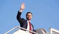 US Vice President JD Vance waves as he boards Air Force Two after attending talks on Iran in Islamabad on April 12, 2026. (Photo by Jacquelyn Martin / POOL / AFP)