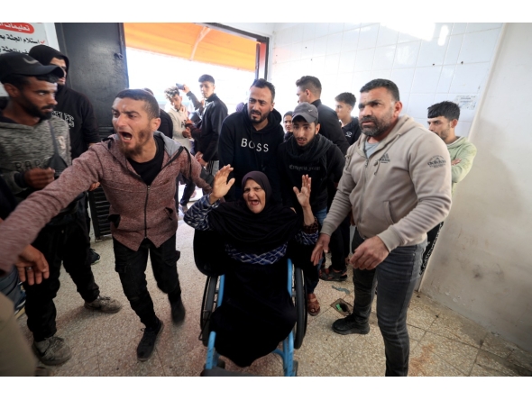 Family members arrive at the Al-Aqsa Martyrs Hospital in Deir al-Balah, where victims have been brought following an Israeli strike on the Al-Maghazi refugee camp in the central Gaza Strip on April 6, 2026. Photo by EYAD BABA / AFP
