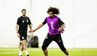 Al Sadd's Akram Afif and Hassan Al Haydos (left) train ahead of the match against Al Hilal SFC.