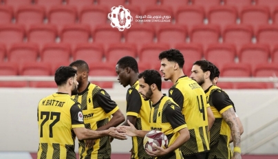 Qatar SC players celebrate a goal against Al Shamal.
