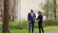 German Chancellor Friedrich Merz and Ukrainian President Volodymyr Zelensky walk in the garden in the backyard of the Chancellery in Berlin on April 14, 2026 (Photo by Odd Andersen/ AFP) 